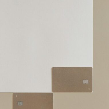 Two blank credit cards placed on a simple neutral background, showcasing modern simplicity.